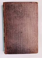 Front cover of an antique brown cloth hardcover book with embossed decorative patterns and some wear to spine corners.