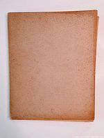 Front cover of the vintage book shows age spots and discoloration.