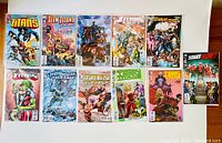 Overview photo of 11 Teen Titans comics laid out showing cover art