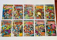 Photo showing a lineup of 10 first series Marvel Comics The Eternals issues from 1976, laid out side by side with colorful covers displaying various characters and scenes from the series.