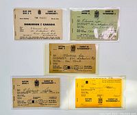 Front view of five Dominion of Canada WWII ration cards in various colors including beige, green, yellow, and off-white. Text includes ration book numbers, serial numbers, and recipient name Florence Lee with New Toronto Ontario address.