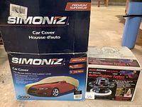 Box of Simoniz XL Car Cover showing front and side with product details about multi-layer fabric and warranty