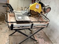 Full view of tile saw mounted on foldable stand