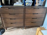Pair of matching oak mid-century modern dressers side by side, showing overall condition and shape
