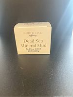 Front view of unopened box of North Oak Apothecary Dead Sea Mineral Mud Facial Mask showing packaging and product details.