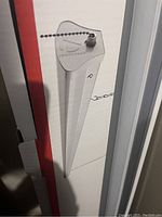 Photo of the outdoor solar light spike fixture with pull chain switch showing the product packaging.