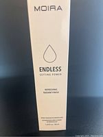 Photo of Moira Endless Setting Power Spray packaging showing product name, brand, and description details.