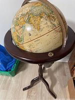 Globe showing Asia, Europe and Africa on mahogany tripod stand