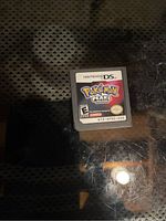 Single Nintendo DS Pokémon Pearl Version game cartridge on reflective surface