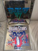 Two vintage rock band mirrors: Van Halen logo mirror and Rolling Stones tour poster mirror