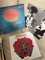 Photo showing the three Santana vinyl records: Caravanserai, Santana III, and Abraxas.