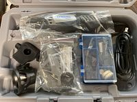 Top view of the rotary tool and accessories packed inside the case