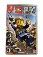 Front cover of the Nintendo Switch game Lego City Undercover, showing the box art with Lego police character swinging on a rope with a badge, police car and city background.