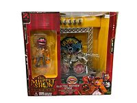 Front of unopened box showing Animal figure at left and stage playset at right