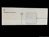 Front view of sealed Apple 85W MagSafe 2 Power Adapter box showing product name and image of power adapter with MagSafe 2 connector.