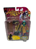 Front view of sealed blister card packaging showing Zoot figure, saxophone, and case