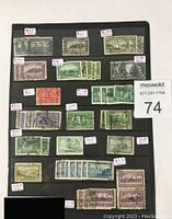 Photo of Canadian stamps mounted on black album page, showing multiple rows of stamps with price tags indicating estimated values ranging from 70 cents to $11.