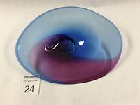 Top view of oval blown glass bowl showing smooth gradient from blue to purple.