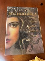 Front cover of the Mythologica coffee table book showing detailed artwork of Medusa and book title and subtitle.