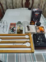 Top-view photo showing all items on a table with focus on packaging and display of kitchen and wine accessories.