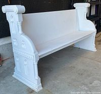 Front and side angle of pew on concrete floor