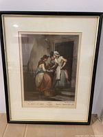 Framed colored print depicting two women and a child on stairs in a historical setting, with text captions at bottom.
