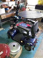 Front three-quarter view showing body, seat and front wire basket
