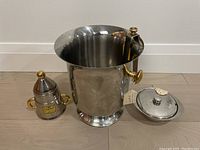 Full view of champagne cooler, sugar bowl with lid, creamer, and tong showing size and finish