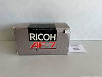 Front view of the Ricoh AF-7 camera box showing branding and model number.