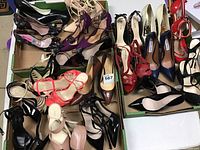 View of the full lot of ladies stilettos in various colors and styles.