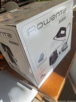 Original packaging box of the Rowenta Pro Precision iron showing branding and features.