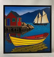 Front view of the framed painting showing a stylized coastal scene with a yellow rowboat, red waterfront building, distant schooner sailing ship, and mountains.