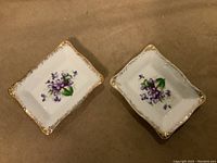 Photo showing two rectangular vintage G & C Haley porcelain trinket dishes with purple floral pattern and gold trim, laid flat on a surface.