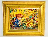 Frontal view of framed ceramic art tile featuring a young girl with sunflowers, showing the gilded frame and detailed colorful artwork.
