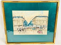 Full view of framed watercolour print showing Paris street with vintage cars and classical buildings under glass with teal mat and gold frame.