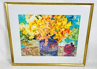 Full view of framed acrylic painting signed by V. Loppe showing vibrant yellow flowers in pots with pomegranate, under glass with white mat and gold frame.