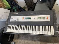 Top view of Farfisa keyboard showing full keys and control panel with wear and dirt.