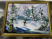 Front view of colorful oil painting with snow-covered trees and skier