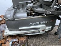 Side view of the Sea King motor with visible branding and specifications showing 3.5 HP with steel starting system.