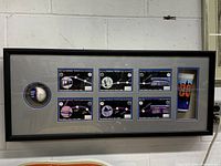 Full view of the framed Subway Series collectible with baseball, panels, and cup arranged horizontally.