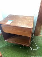 Pair of nightstands next to each other showing overall shape and finish wear