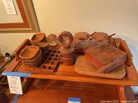 Full view of tray loaded with bowls, jars, cheese board and grinder