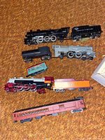 Overview of locomotives and cars on carpet