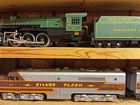 Green Southern Railway Crescent Limited steam locomotive and tender on wooden shelf