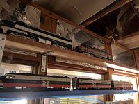 Overview of two shelves showing locomotives and passenger cars