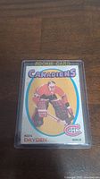 Front of Ken Dryden rookie card in plastic sleeve, full view