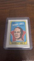 Front cover of the Bobby Hull Story booklet with player illustration and title.