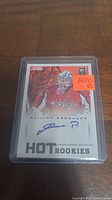 Front side of Philipp Grubauer rookie card showing player image, autograph, and Hot Rookies title with sticker indication of autograph and rookie card.