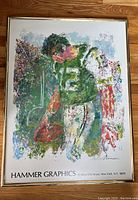 Front view of framed Leroy Neiman artwork depicting Joe Namath in a NY Jets uniform, signed and marked with Hammer Graphics address.