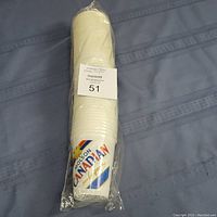 Photo of unopened sleeve containing approximately 50 stacked plastic Molson Canadian disposable beer cups in original plastic wrapping.